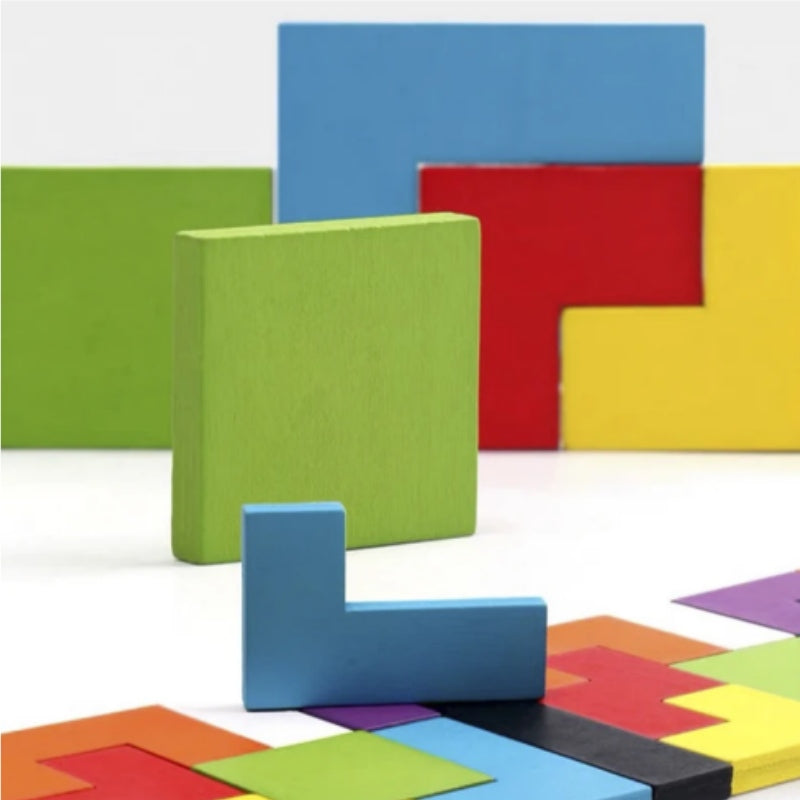 Close-up of colorful 3D wooden tetris puzzle pieces standing next to a partially filled puzzle board.