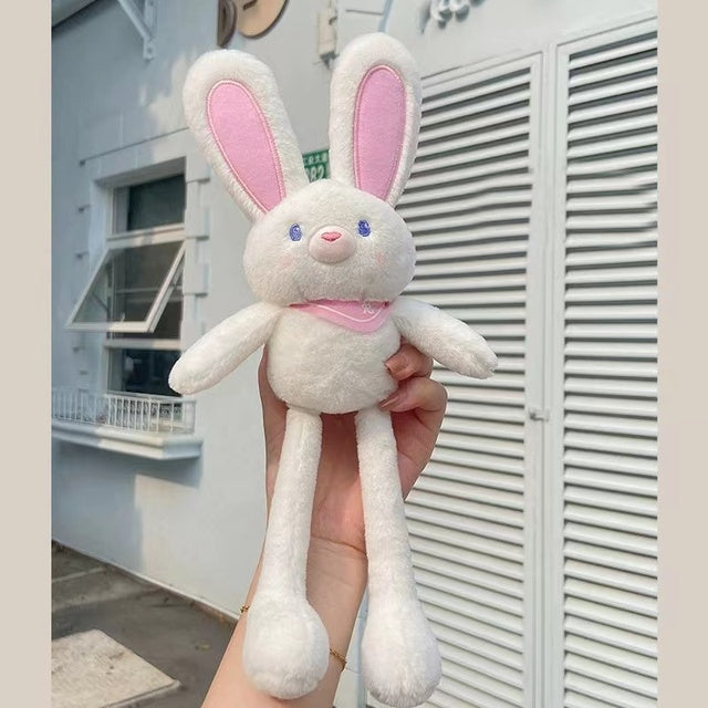 A white plush rabbit with ears and legs that can be pulled to make them longer or shorter