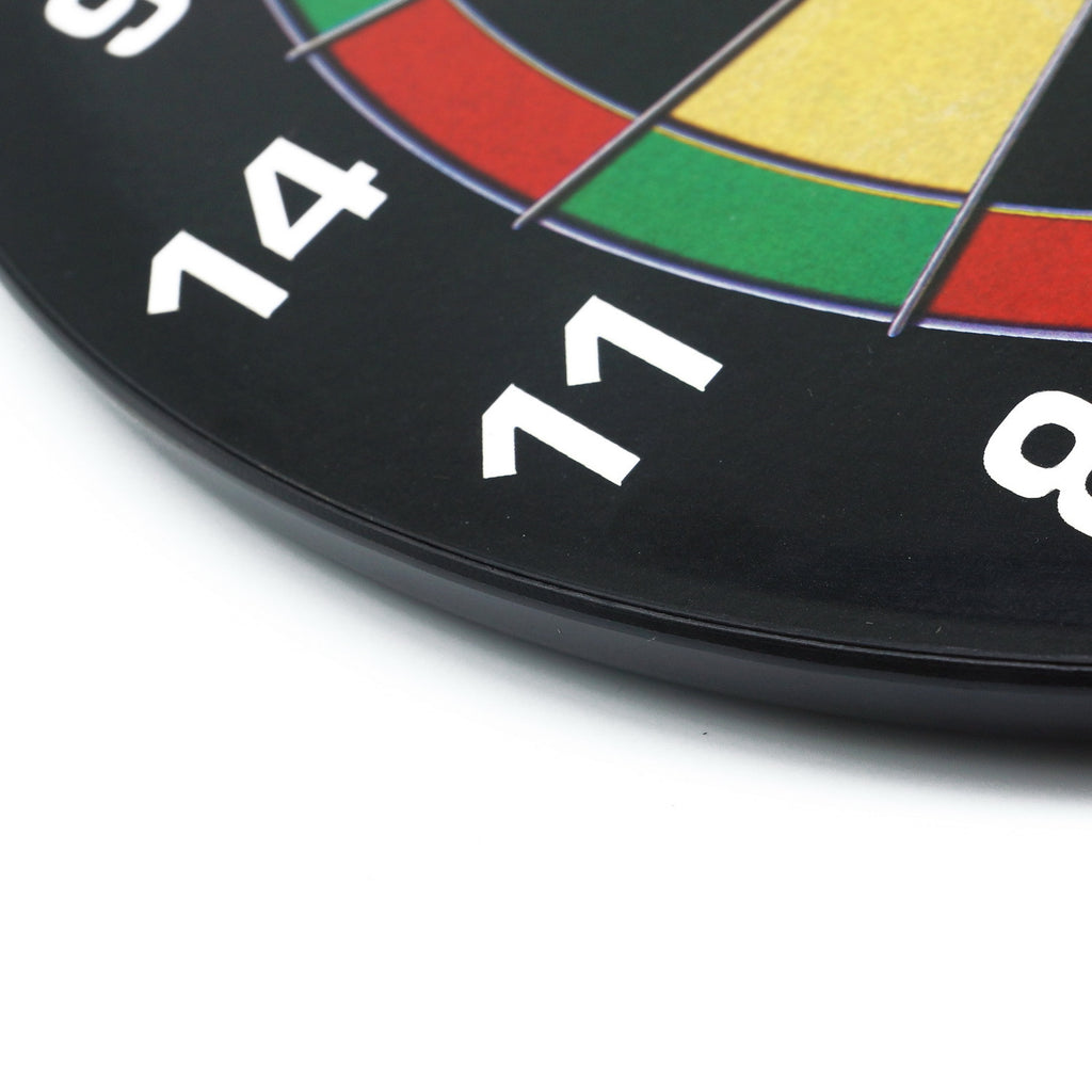 Close-up edge detail of a children's magnetic dartboard showing numbered sections and board thickness.