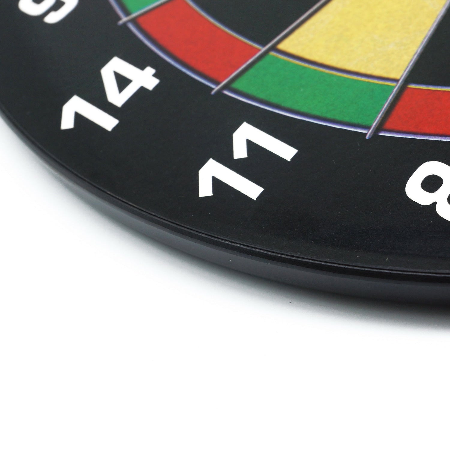 Close-up edge detail of a children's magnetic dartboard showing numbered sections and board thickness.