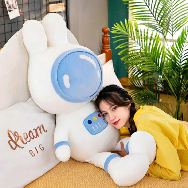 Large blue space bunny plush toy for cuddling, soft astronaut rabbit stuffed animal in bedroom, cozy sleep companion plush pillow for kids and teens