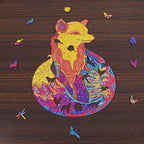 Colorful fox-shaped wooden puzzle with intricate mandala patterns and whimsical animal pieces on a dark wood background.