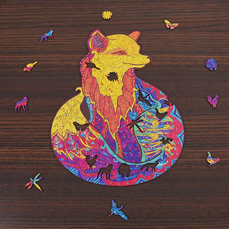 Colorful fox-shaped wooden puzzle with intricate mandala patterns and whimsical animal pieces on a dark wood background.