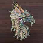 Intricate dragon head wooden puzzle with colorful scale patterns displayed on a dark wood background.