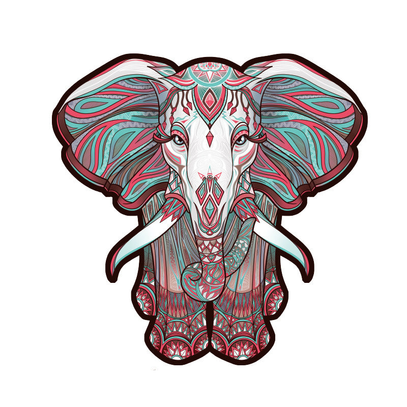 Intricate elephant wooden puzzle with teal and pink mandala patterns on white background.