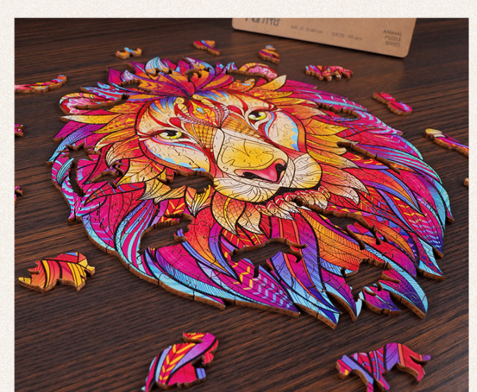 Viewed from the side, a colorful wooden lion head puzzle is complete, showcasing layered wood grain and unique animal puzzle pieces scattered throughout.