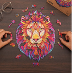 Vibrant lion head wooden puzzle with mandala patterns and unique animal-shaped pieces being assembled on a dark wood table.