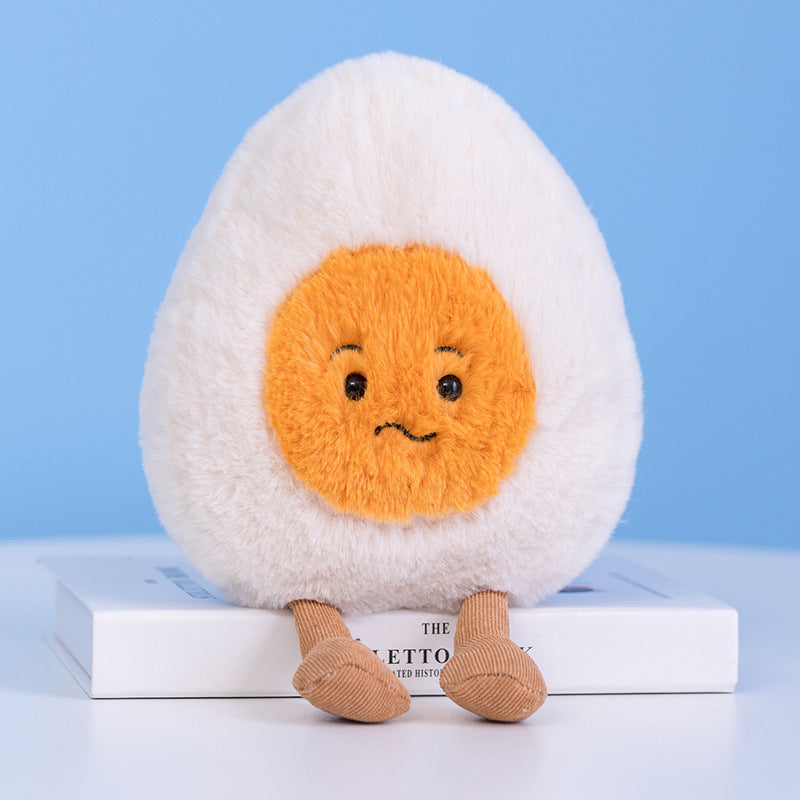 Cute boiled egg plush toy with neutral pout expression, fluffy plush texture and corduroy short legs, realistic food shaped stuffed doll for bedroom decoration