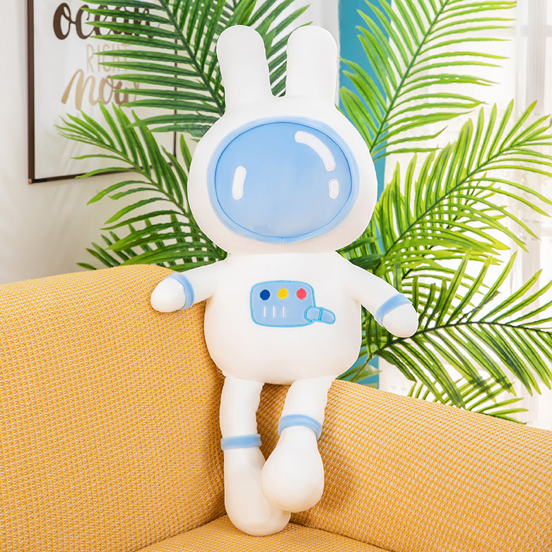 Blue space bunny plush toy with astronaut helmet design, soft fluffy rabbit stuffed animal on cozy yellow sofa, cute space themed plush pillow decoration