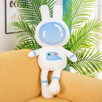 Blue space bunny plush toy with astronaut helmet design, soft fluffy rabbit stuffed animal on cozy yellow sofa, cute space themed plush pillow decoration