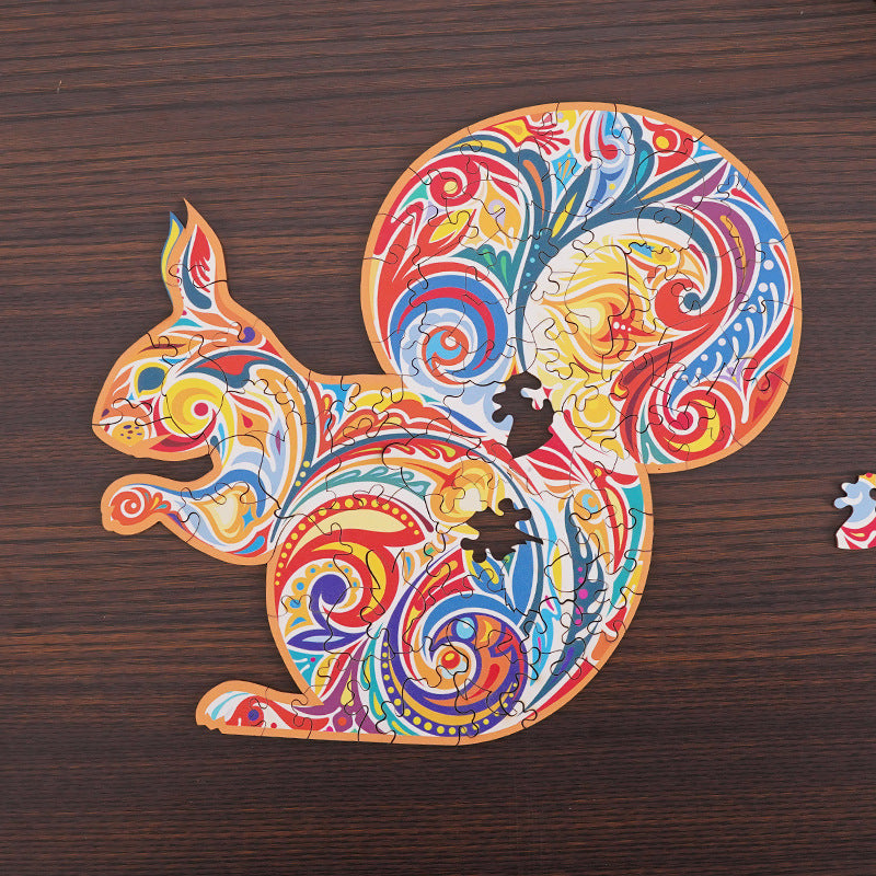 Colorful squirrel-shaped wooden puzzle with swirling patterns and missing pieces showing unique cutouts.