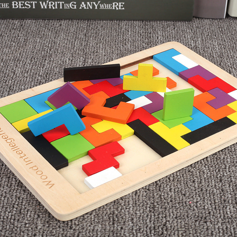 Wooden tetris puzzle game laid flat with colorful 3D geometric pieces standing on the board.