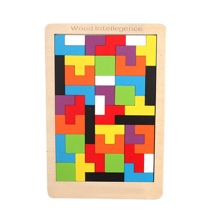 Fully solved colorful wooden tetris puzzle on a white background.